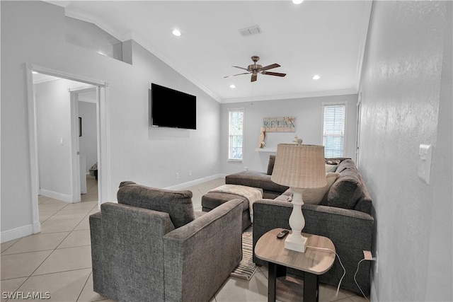 living room with vaulted ceiling, ceiling fan, light tile patterned floors, and crown molding