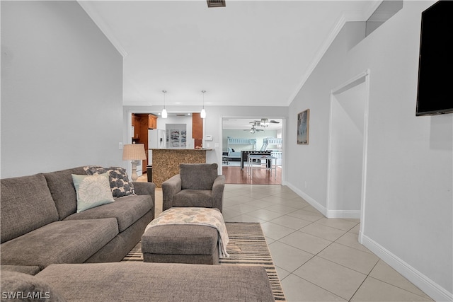 living room featuring crown molding, light hardwood / wood-style flooring, and lofted ceiling