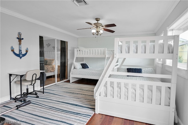 bedroom with crown molding, ceiling fan, and hardwood / wood-style floors