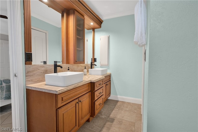 bathroom featuring dual vanity, tile patterned floors, and crown molding