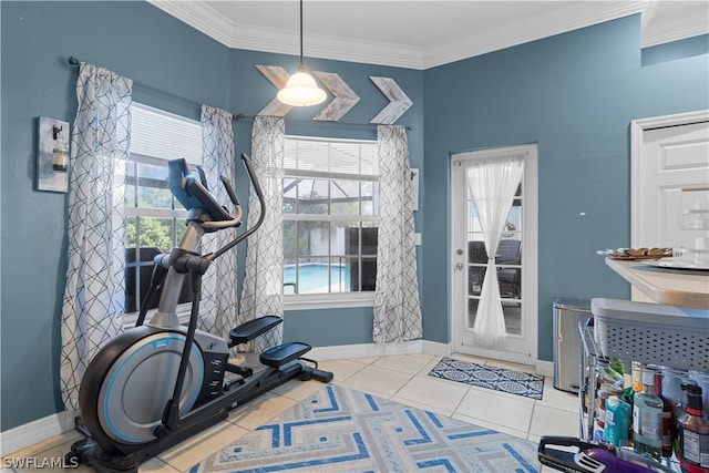 exercise area featuring light tile patterned flooring and ornamental molding