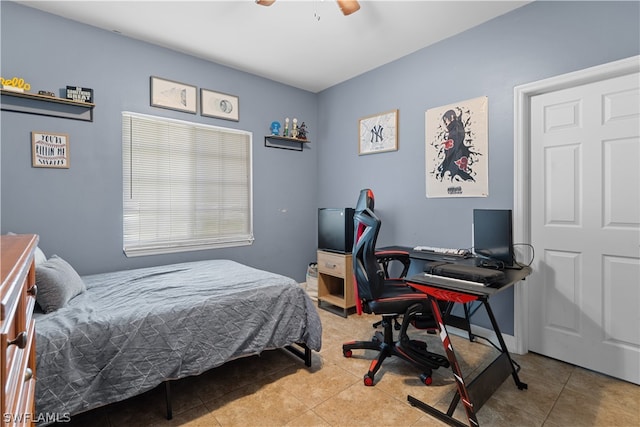 bedroom featuring light tile patterned floors and ceiling fan