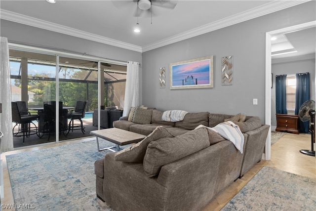 tiled living room featuring ornamental molding and ceiling fan