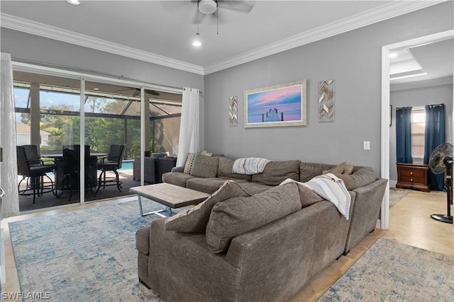 living room with crown molding and ceiling fan