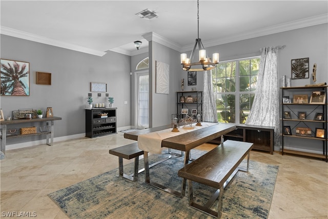 tiled dining area with an inviting chandelier and ornamental molding