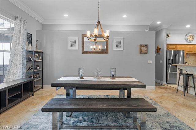 tiled dining room featuring crown molding and a chandelier