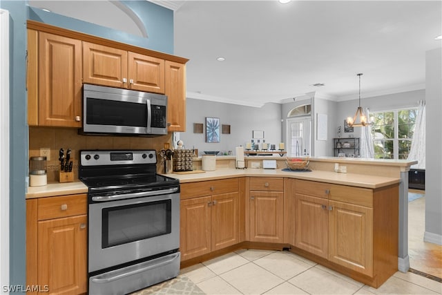 kitchen featuring a chandelier, kitchen peninsula, appliances with stainless steel finishes, light tile patterned floors, and backsplash