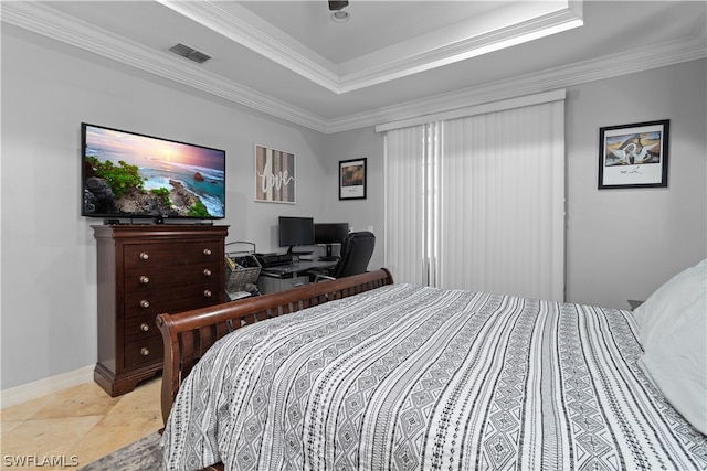 tiled bedroom featuring ornamental molding and a tray ceiling