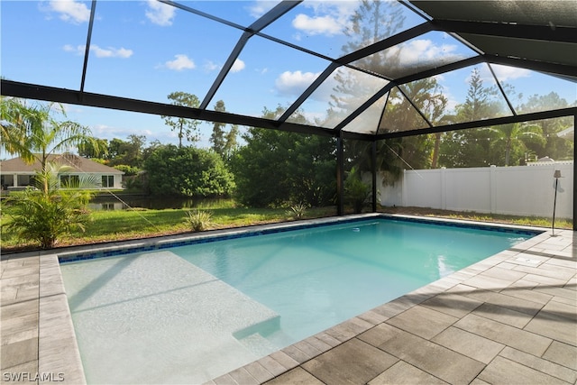 view of swimming pool featuring a patio area and glass enclosure