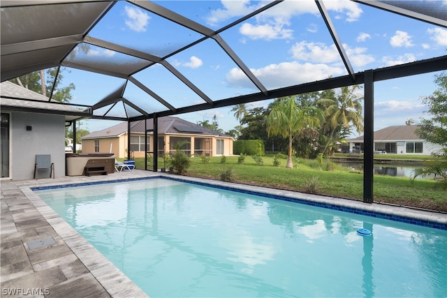 view of swimming pool featuring a lawn and glass enclosure