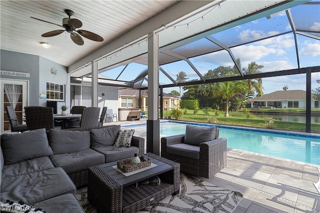 view of pool featuring a patio area, ceiling fan, glass enclosure, and outdoor lounge area