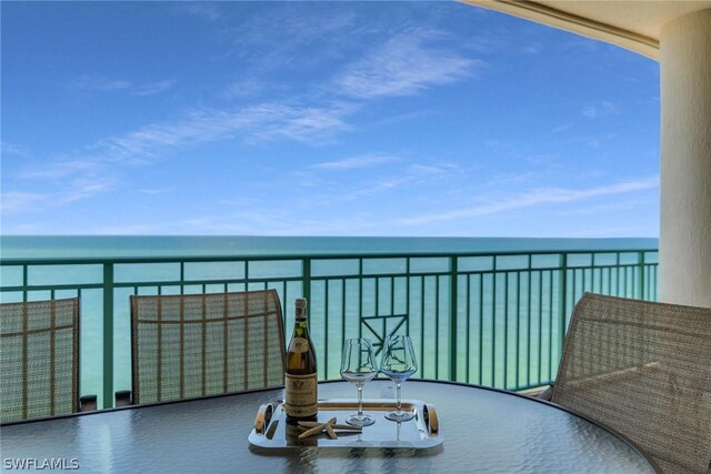 balcony featuring a water view