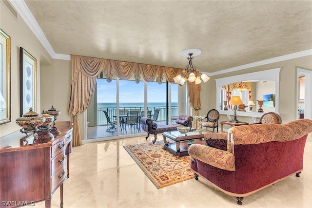 living room featuring ornamental molding, a water view, and an inviting chandelier