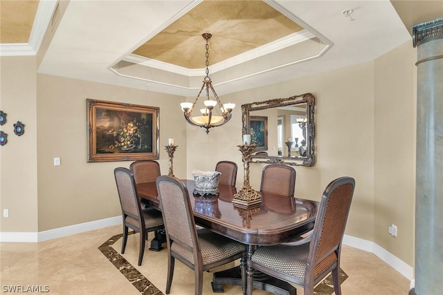 dining area with an inviting chandelier, ornamental molding, and a raised ceiling