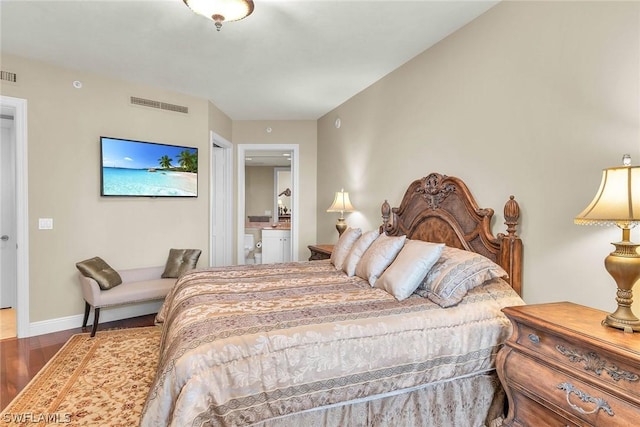 bedroom with hardwood / wood-style flooring