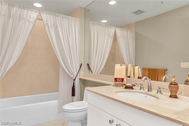 full bathroom with shower / tub combo, vanity, and toilet