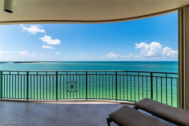 balcony featuring a water view