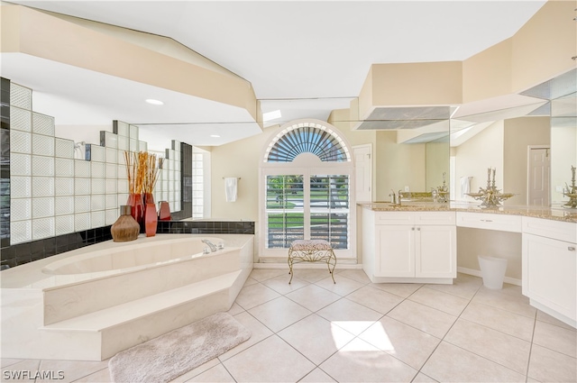 bathroom featuring a bath, tile patterned flooring, and vanity