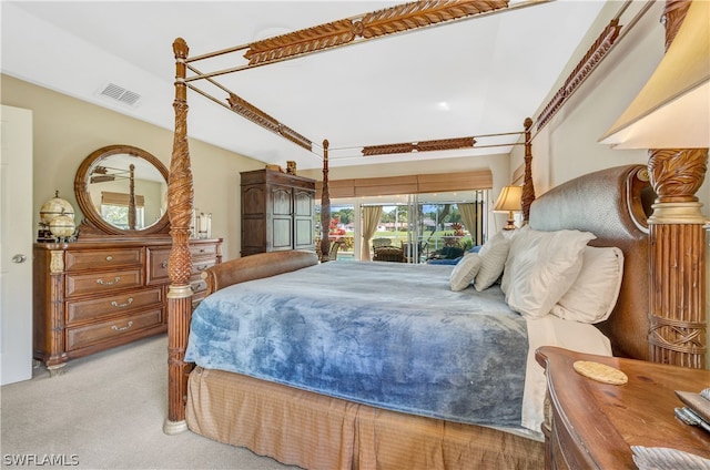 bedroom featuring visible vents and light colored carpet