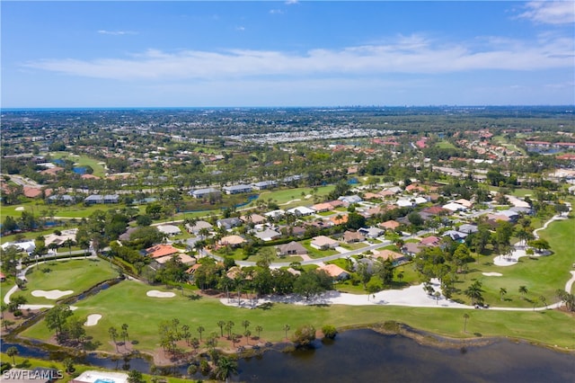 drone / aerial view featuring a water view, a residential view, and golf course view