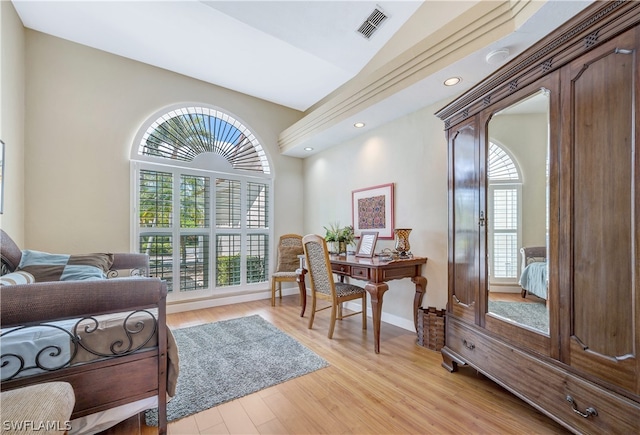 sitting room featuring recessed lighting, visible vents, light wood-style floors, vaulted ceiling, and baseboards