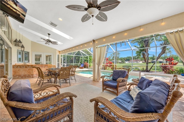 sunroom featuring a pool, visible vents, vaulted ceiling, and a ceiling fan