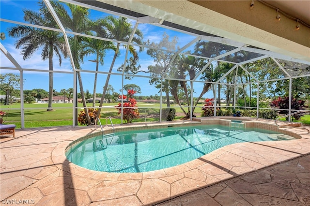 view of pool featuring glass enclosure, a yard, a patio area, and a pool with connected hot tub