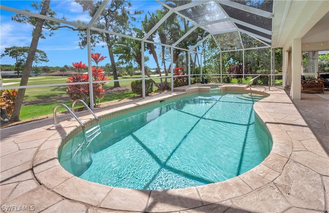 pool featuring glass enclosure and a patio