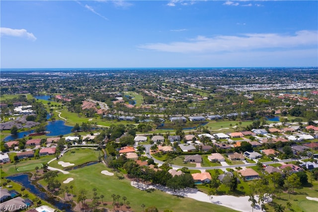 bird's eye view with a residential view, a water view, and golf course view