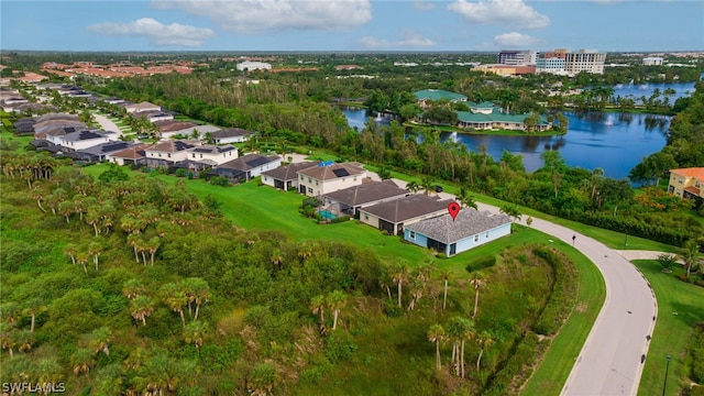 birds eye view of property with a water view