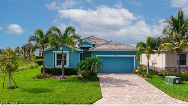 single story home with a front lawn and a garage