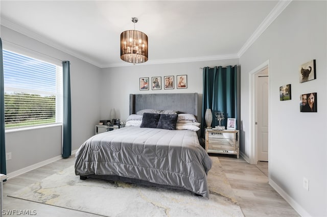 bedroom with a notable chandelier, light wood-type flooring, and ornamental molding