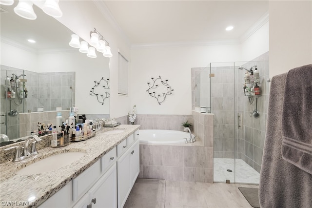 bathroom featuring tile patterned flooring, ornamental molding, separate shower and tub, and vanity