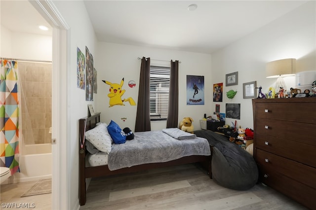 bedroom with light wood-type flooring