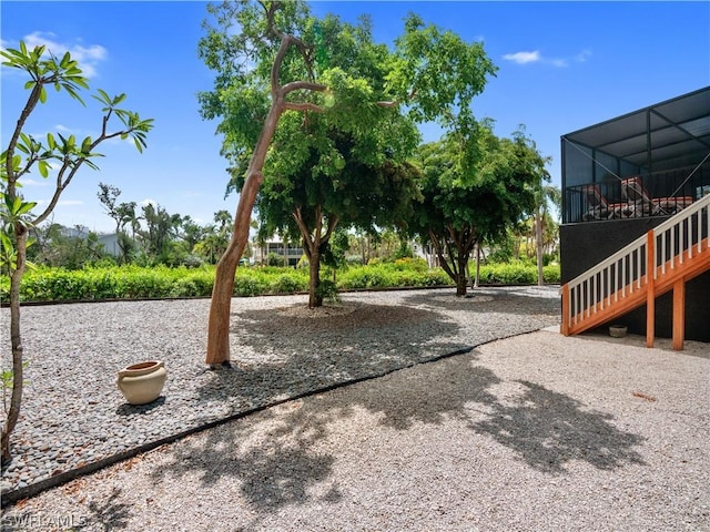 view of yard featuring a lanai