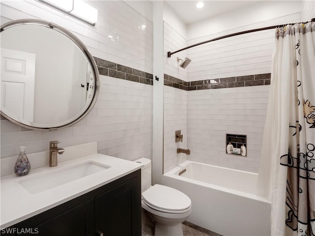 full bathroom with tile walls, toilet, decorative backsplash, shower / bath combo, and vanity