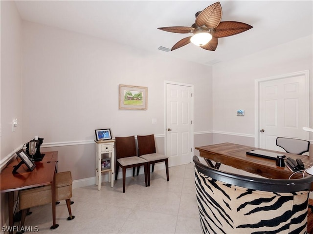 interior space with ceiling fan