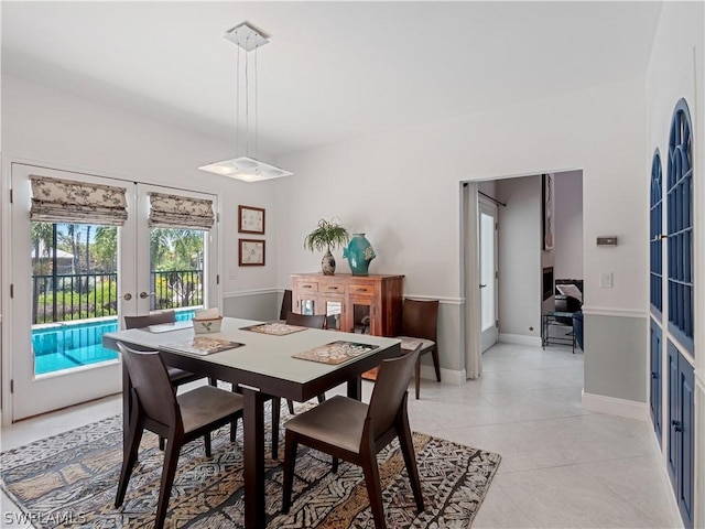 tiled dining room with french doors