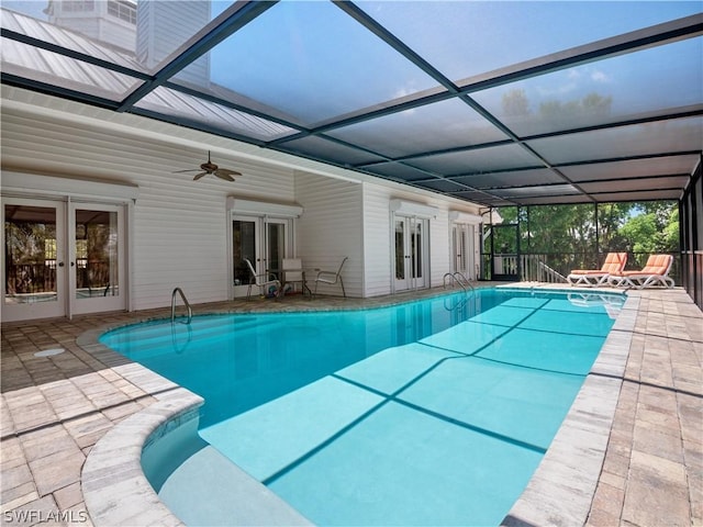 view of pool featuring french doors, a lanai, ceiling fan, and a patio area