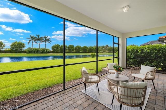 sunroom with a water view