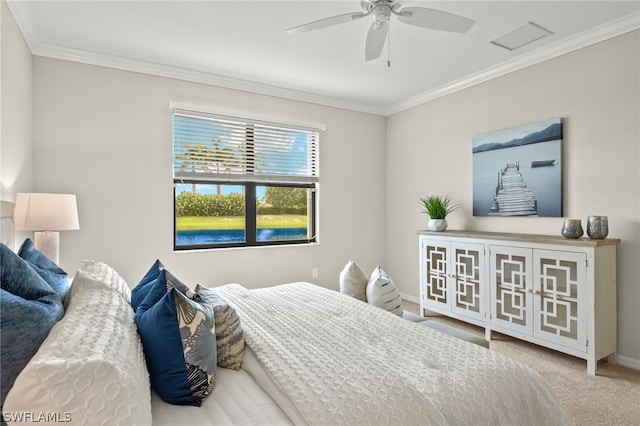 bedroom featuring ceiling fan, crown molding, and light carpet