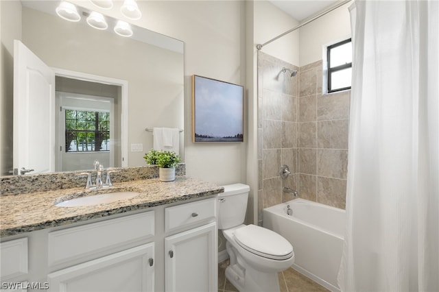 full bathroom with tile patterned flooring, vanity, shower / bath combo, and toilet