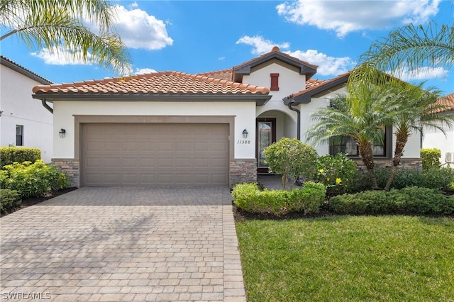 mediterranean / spanish-style home with a garage