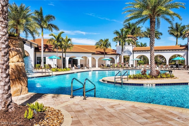 view of swimming pool featuring a patio area and pool water feature