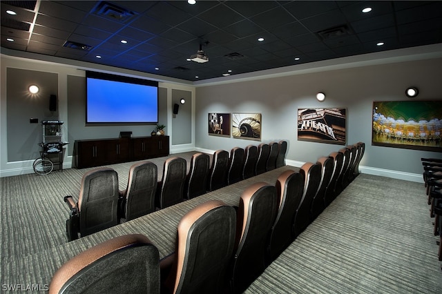 carpeted cinema room featuring a drop ceiling and ceiling fan