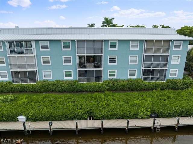 view of building exterior with a water view