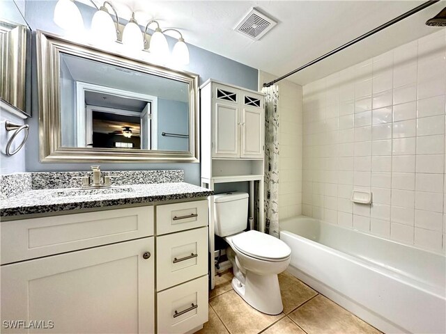 full bathroom featuring shower / bathtub combination with curtain, vanity, toilet, and tile patterned flooring