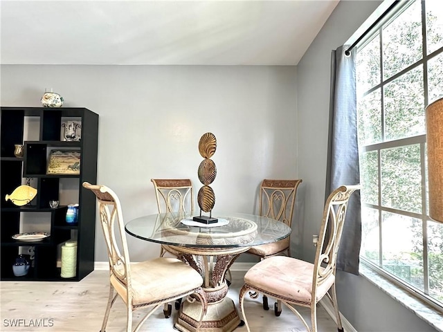 dining space featuring light wood-type flooring