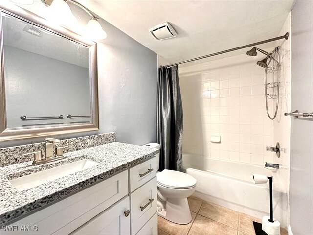 full bathroom featuring vanity, shower / bath combo, tile patterned floors, and toilet