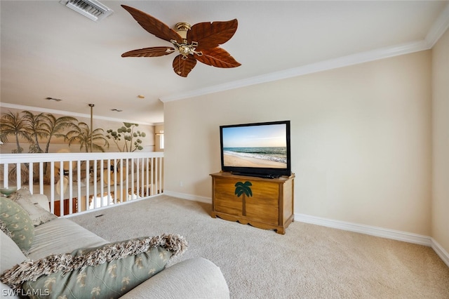 living area featuring ceiling fan, carpet, and ornamental molding